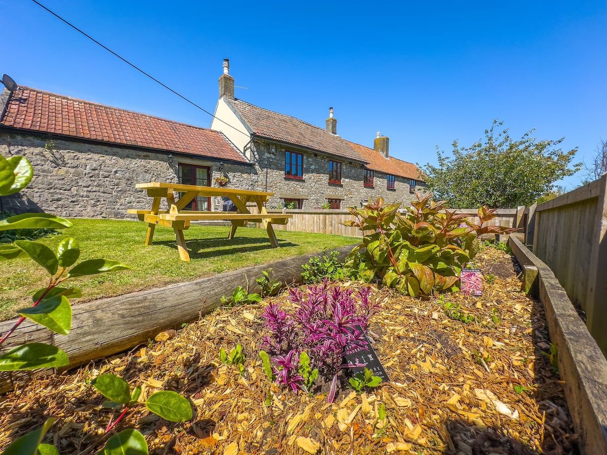 The enclosed garden and patio doors at Farm Cottage, Kewstoke