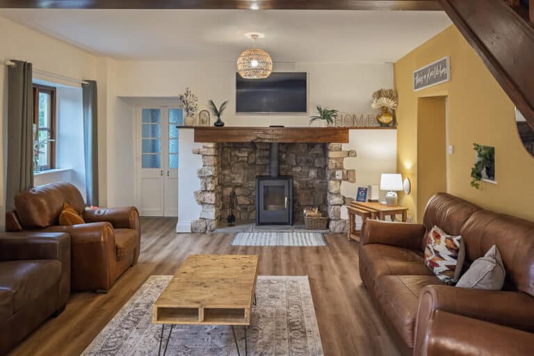 Living room with fireplace, log burner, TV with Netflix, fast wifi at Inglenook Cottage – dog-friendly holiday cottage in Kewstoke, Weston-super-Mare
